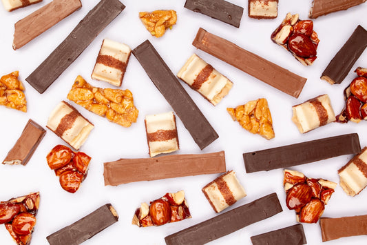 Assortment of chocolate bars and candy pieces.