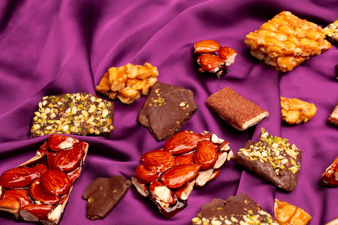 Assortment of nut and chocolate confections on purple fabric
