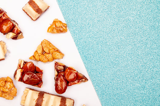 Assortment of candies and nuts on a blue background