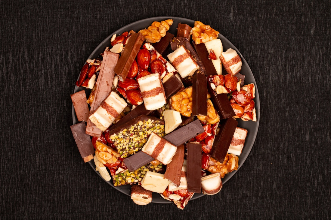 Assortment of chocolate bars and candies on a plate