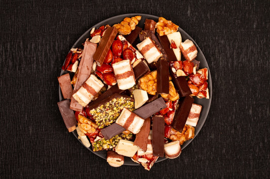 Assortment of chocolate bars and candies on a plate