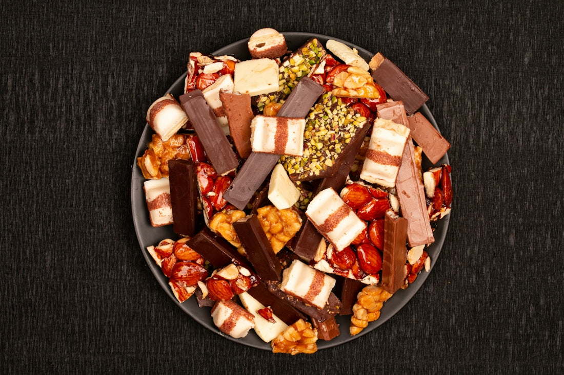 A plate full of assorted chocolate bars and candies
