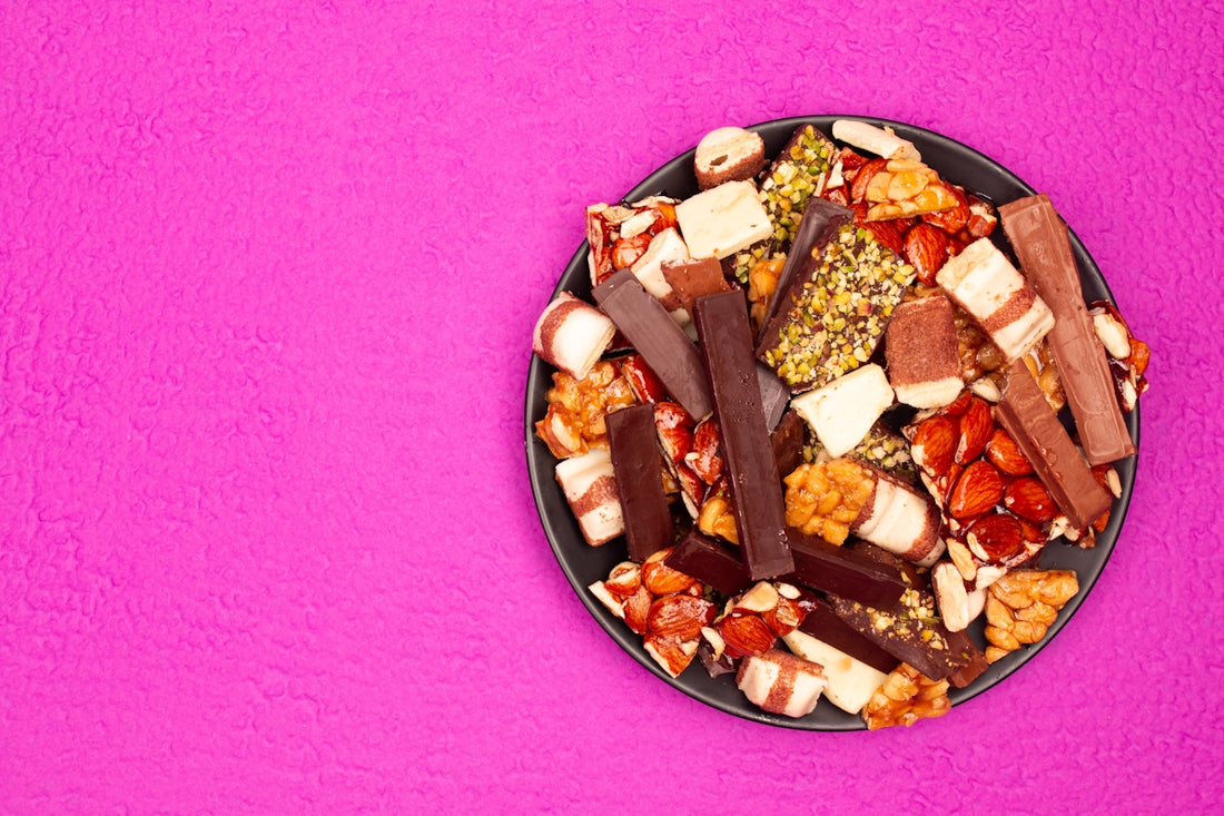 A plate of assorted candy bars and snacks