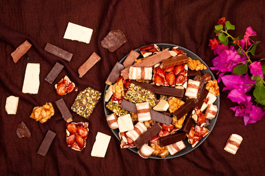 Assortment of chocolates and sweets on a dark cloth.