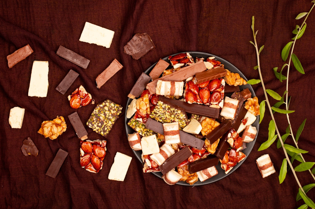 Assortment of chocolates and candies on a dark cloth.