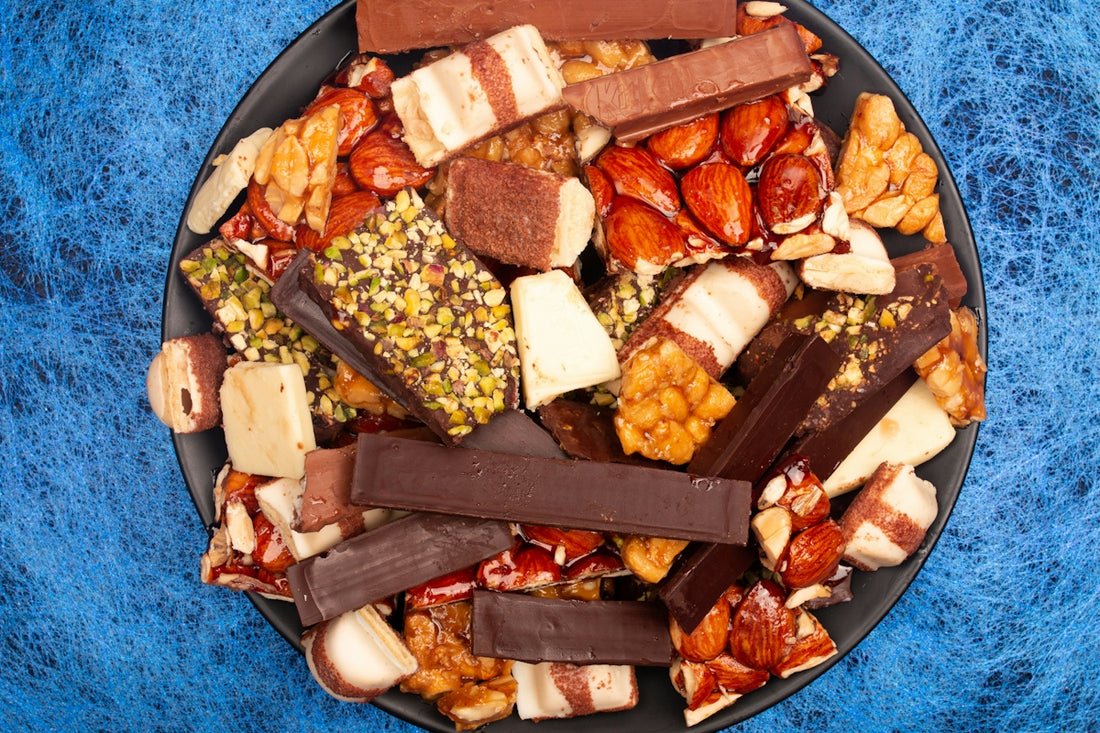 A pile of assorted chocolate bars and nuts