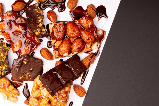 Assortment of chocolate bars with nuts and syrup