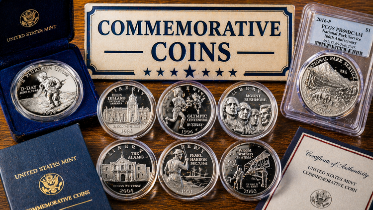 U.S. commemorative coins collection with proof silver coins and PCGS graded coin in display cases